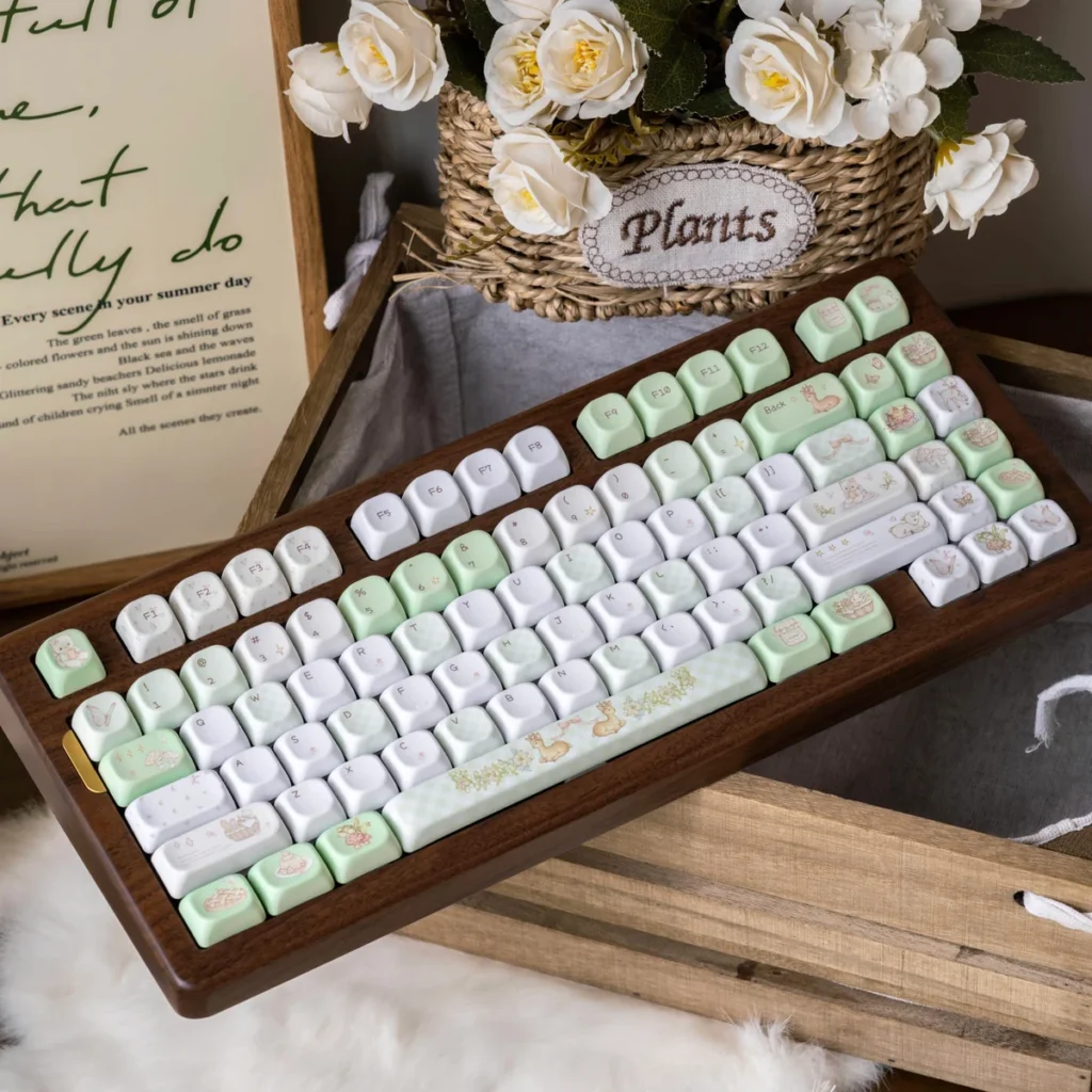 Deep Forest Deer Keycap Set installed on a full-size keyboard with forest and deer artwork