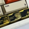 Overhead shot of the Delta Force keycap highlighting the 'Map Access Key' details and gold accents.