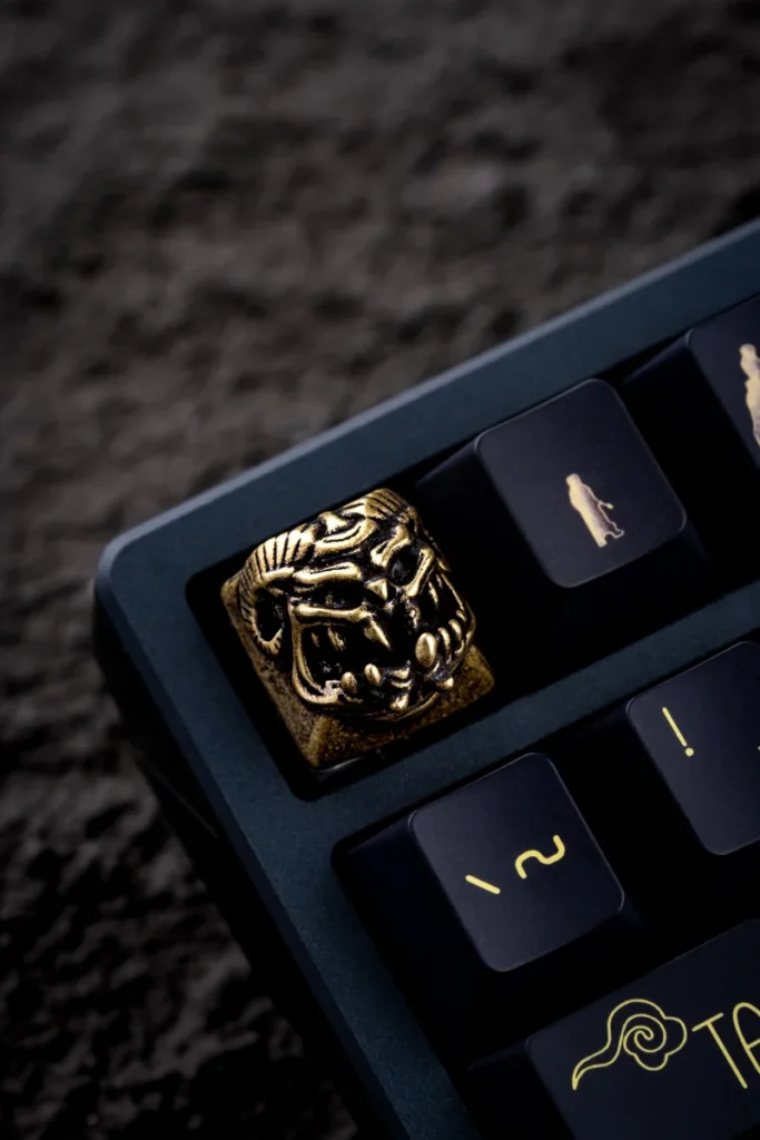 Collection of Demon Handcrafted Keycaps in different metallic options