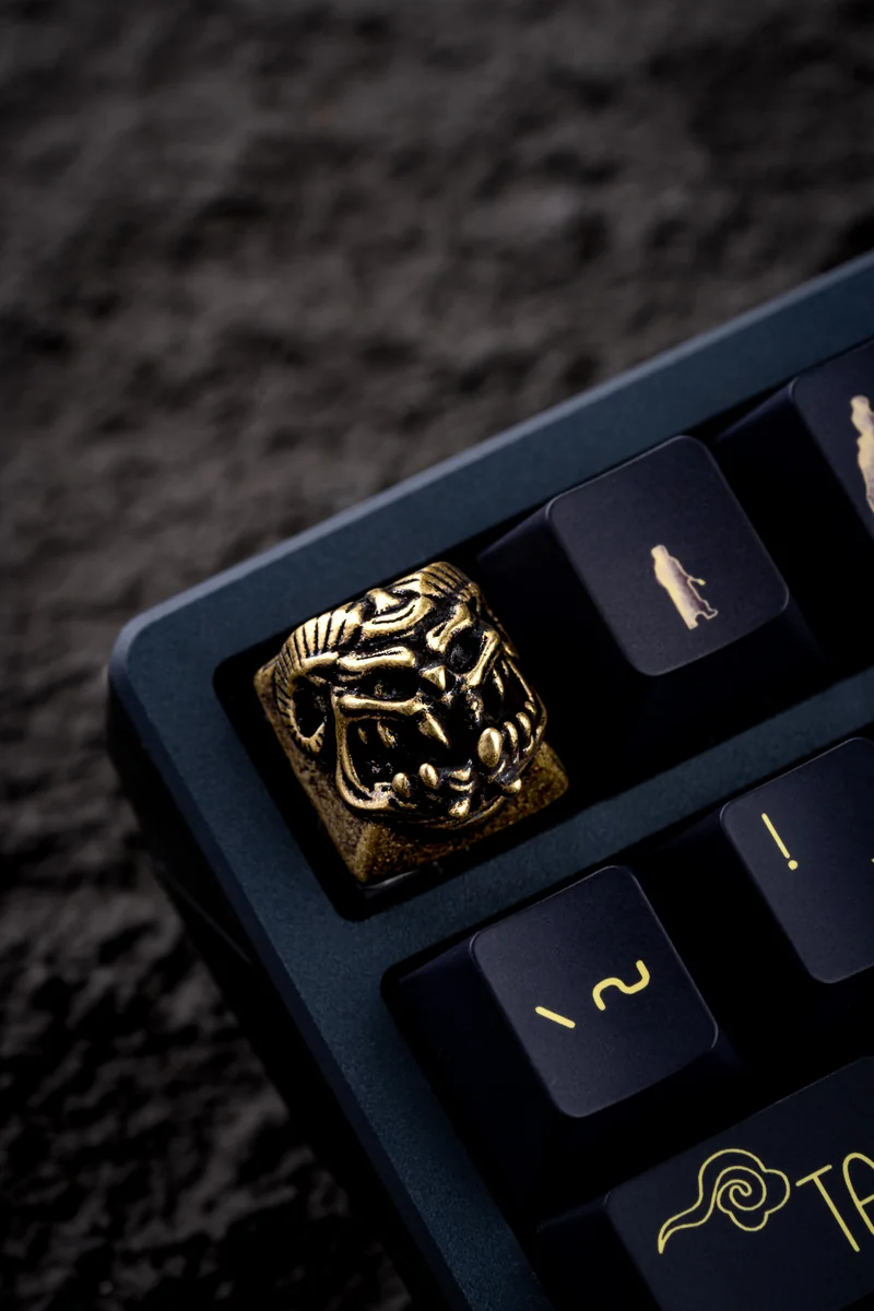 Collection of Demon Handcrafted Keycaps in different metallic options