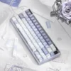 Keyboard featuring Ethereal Butterfly keycaps, paired with a matching aesthetic setup
