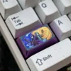 Close-up detail of the Fern character artisan keycap, highlighting the smooth titanium finish