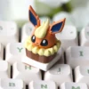 Close-up of Flareon Cake Artisan Keycap, showcasing intricate resin details and vibrant colors on a mechanical keyboard.
