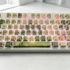 Overhead view of the full 130-key Jasmine Snow Bud set, arranged neatly, displaying the Cherry profile and consistent design.