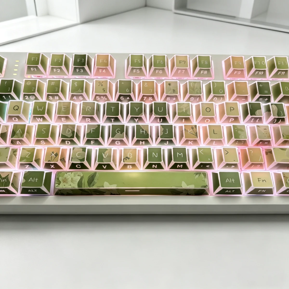 Overhead view of the full 130-key Jasmine Snow Bud set, arranged neatly, displaying the Cherry profile and consistent design.