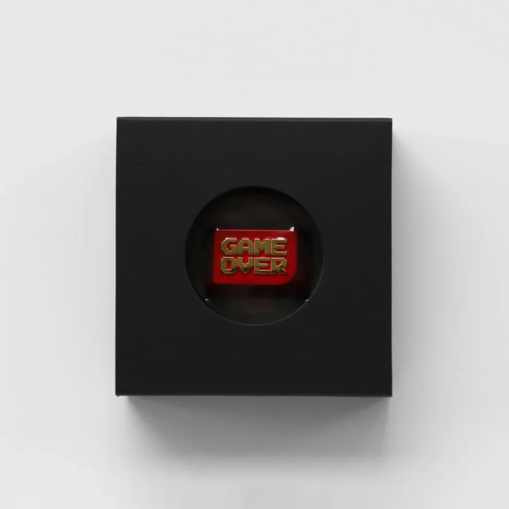 Detailed view of the Game Over keycap's side profile, highlighting its premium zinc alloy texture and Cherry profile design, installed on a gaming keyboard setup.