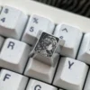 Close-up of precision engraved Genshin Impact character on titanium keycap