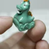 Artisan Green Pony Keycap in a lush green setting, emphasizing nature theme