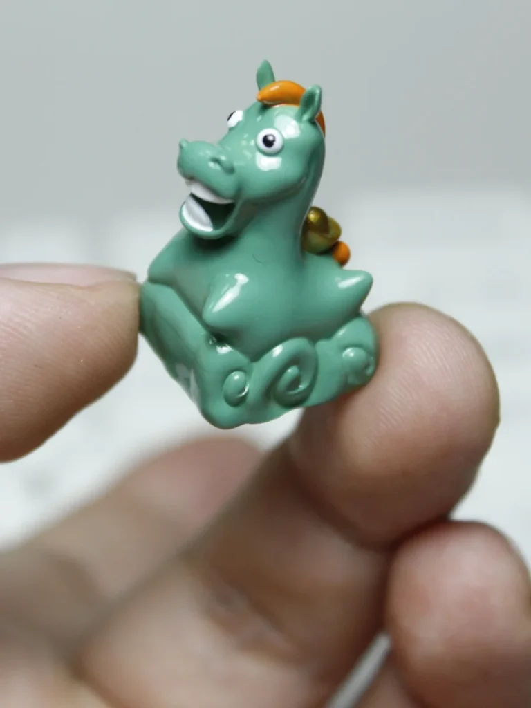 Artisan Green Pony Keycap in a lush green setting, emphasizing nature theme