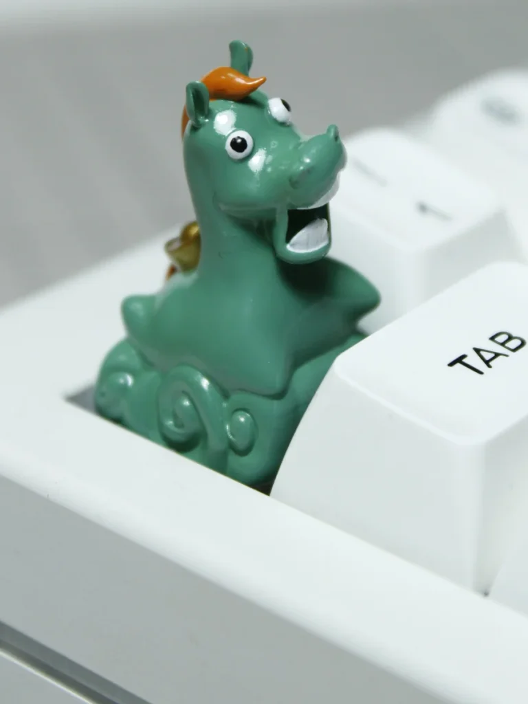 Close-up of Green Pony Keycap, highlighting handcrafted resin details