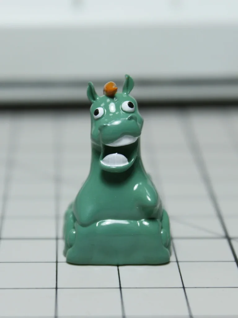 Green Pony Keycap on mechanical keyboard, showing whimsical meadow art