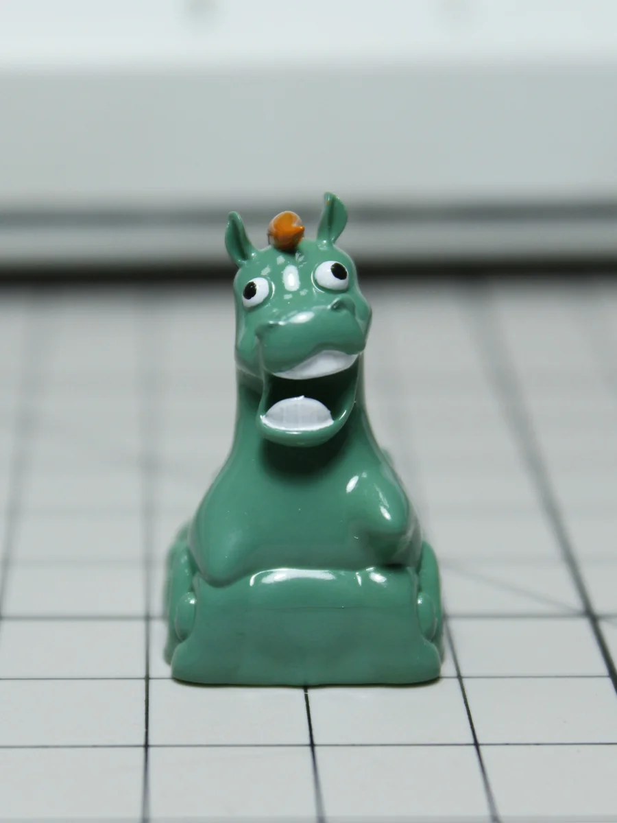 Green Pony Keycap on mechanical keyboard, showing whimsical meadow art
