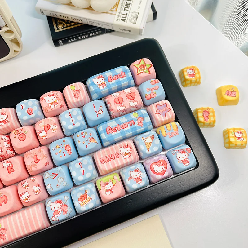 Hello Kitty keycap set spread out, showing full 130-key layout compatibility