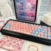 Detailed shot of dye-sublimated Hello Kitty legends on keycaps