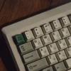 Close-up of hollow Russian legends on PBT keycaps, vintage grey-white color