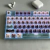 Kaiju No. 8 themed desk setup with keycaps glowing with RGB lighting