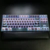 Comparison of Kaiju No. 8 keycaps with and without backlighting active