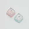 Handcrafted resin Maltese Dog ESC keycap in blue hat shown close up
