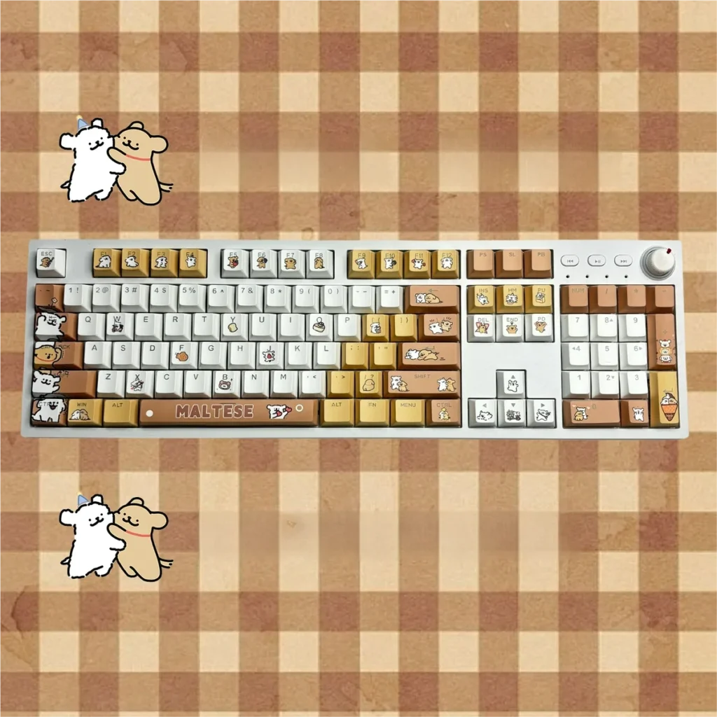 Close-up of Maltese Dog line art keycaps in warm tones