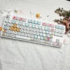 Maltese Dog Apple Keycap Set installed on a white keyboard setup