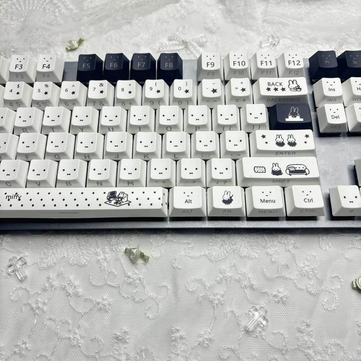 Close-up of Miffy keycaps showing side-printed shine-through legends and Cherry profile