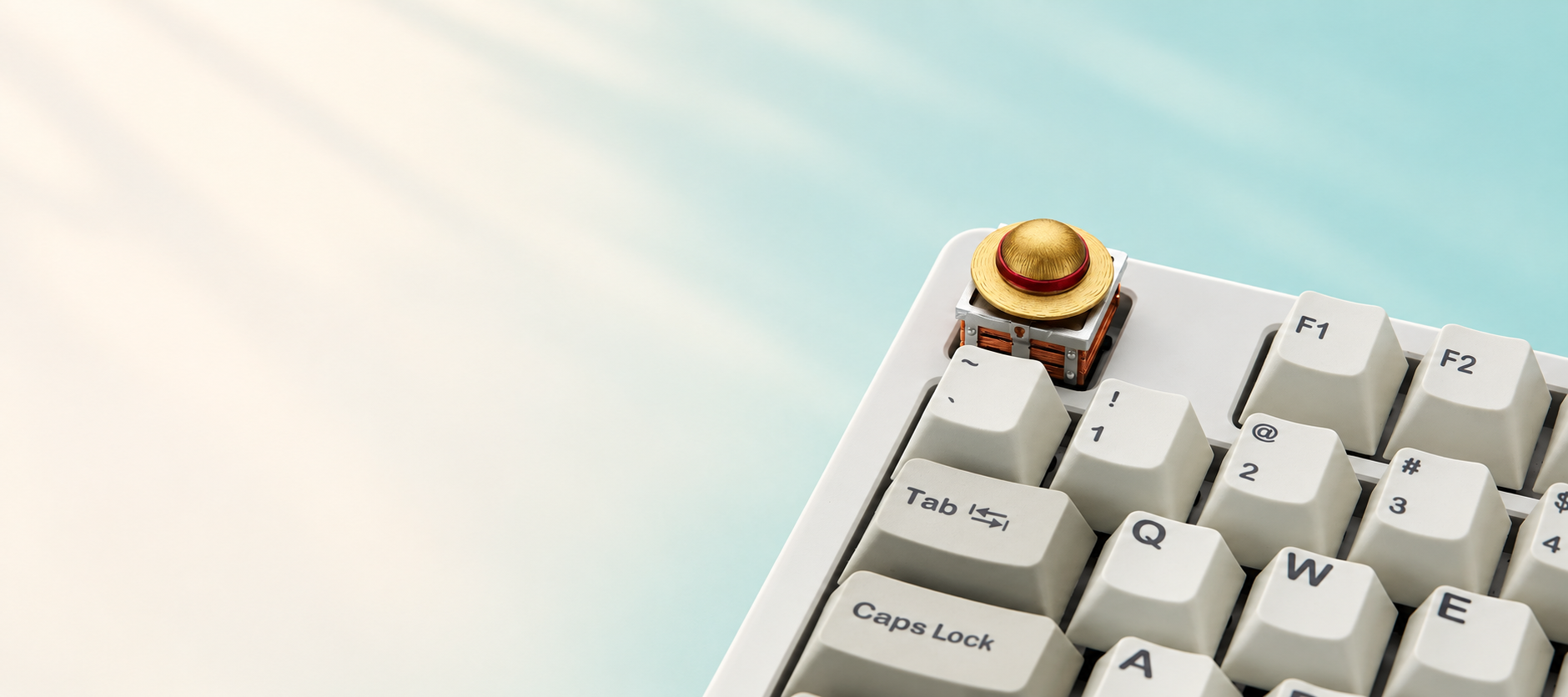 One Piece Luffy rotating straw hat artisan keycap on a cream keyboard