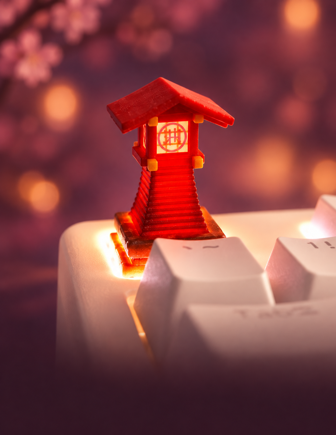 Studio Ghibli red lantern-shaped artisan keycap on a white keyboard