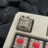 Oni Warrior keycap illuminating under keyboard backlighting, showing texture.