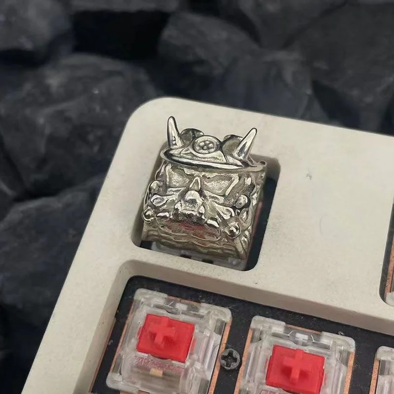 Oni Warrior keycap illuminating under keyboard backlighting, showing texture.
