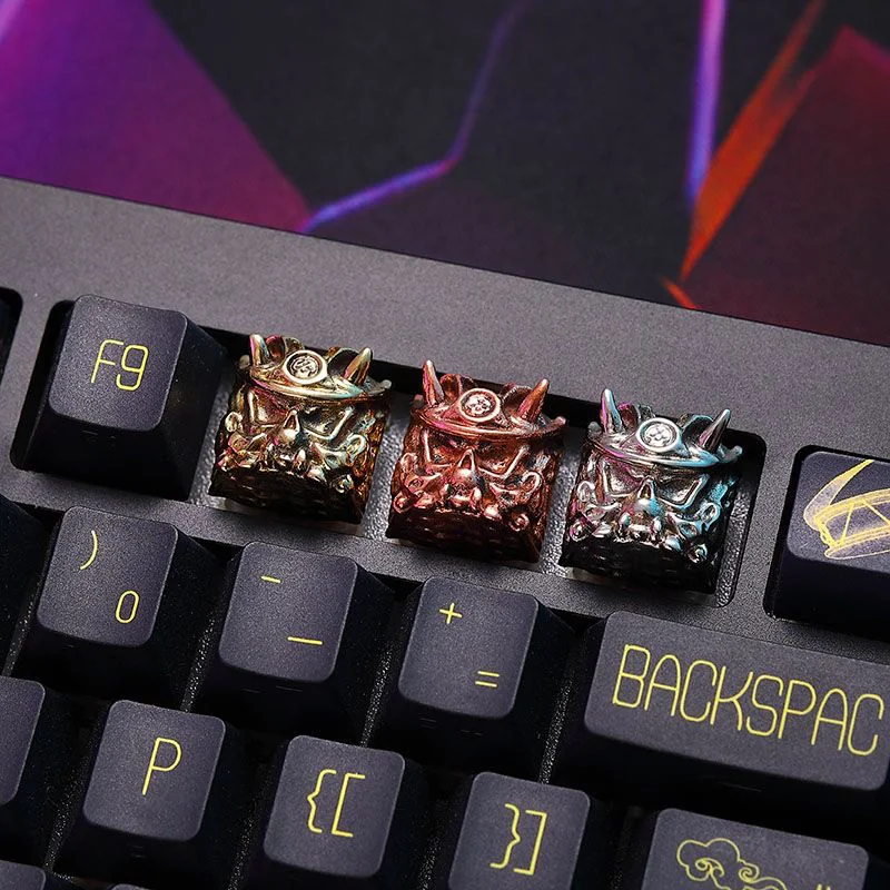 Oni Warrior artisan keycap in white copper, mounted on a mechanical keyboard.