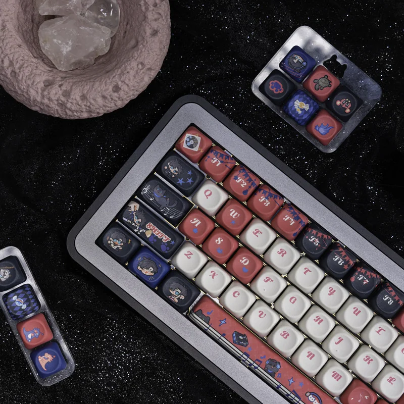 Close-up of Light and Night Osborn character art on PBT keycaps