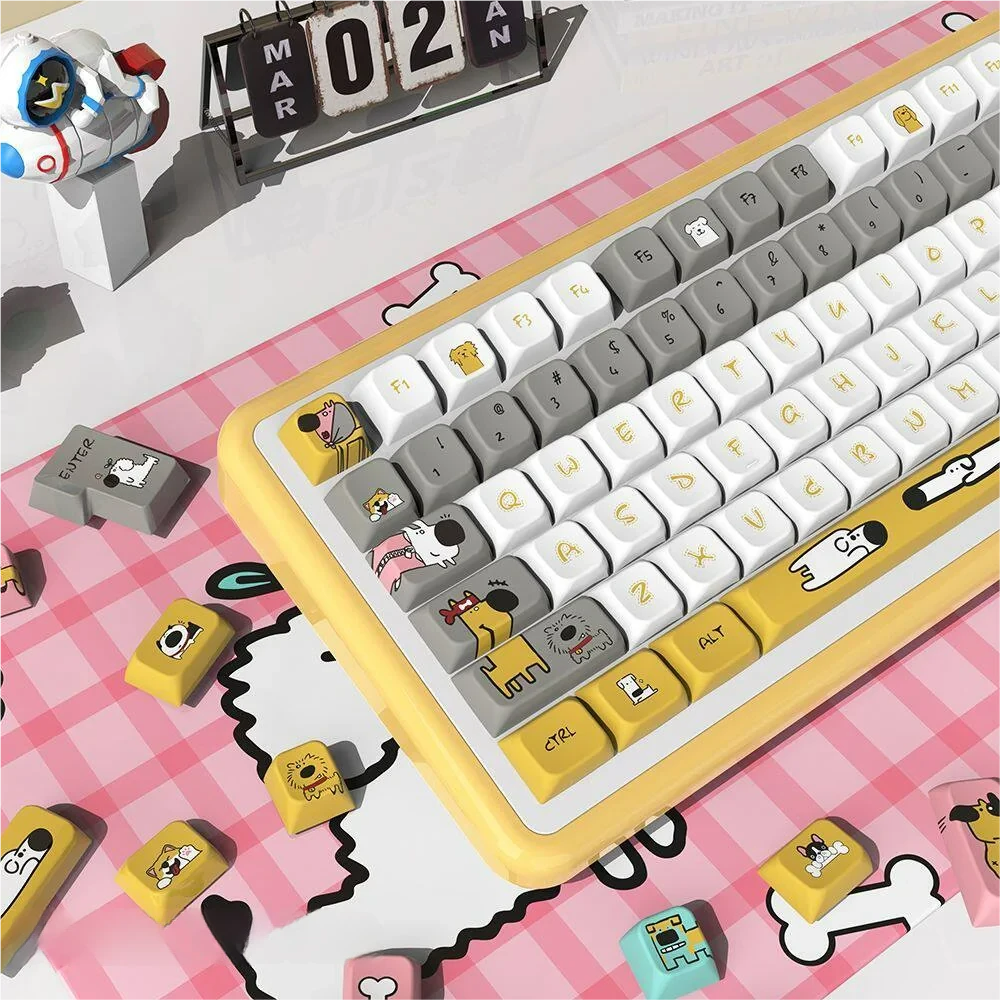 Close-up of PBT MDA profile keycaps with dog designs