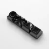 Close-up of a single piano black keycap showcasing its smooth, reflective finish.