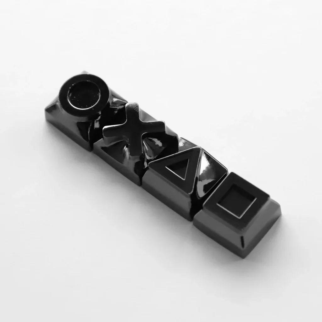 Close-up of a single piano black keycap showcasing its smooth, reflective finish.