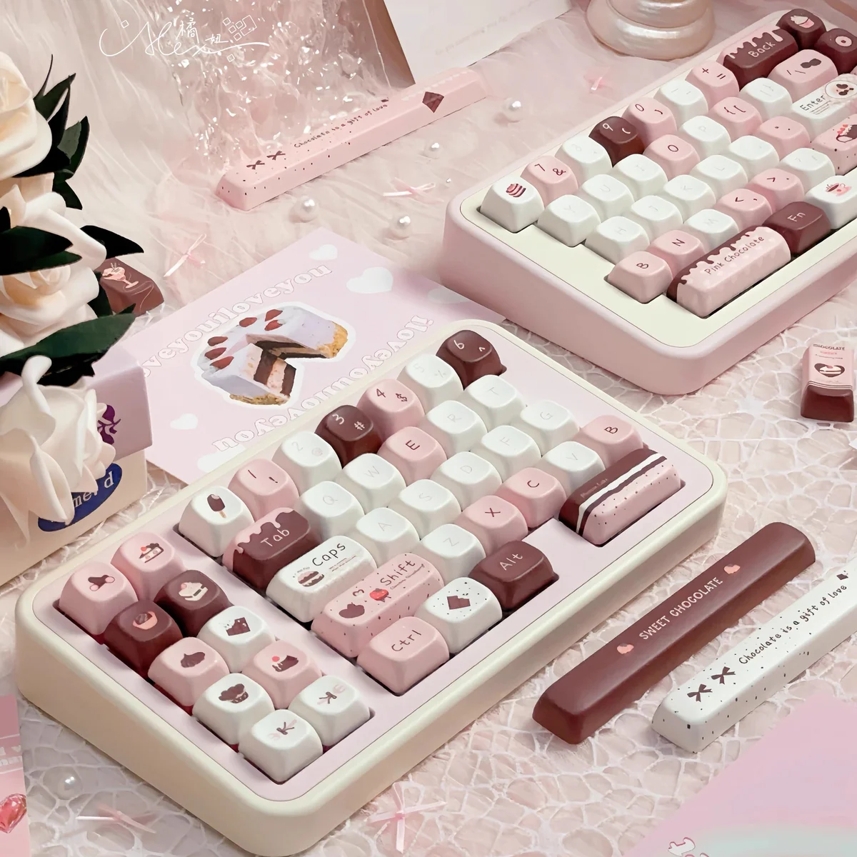 Detailed shot of pink, brown, and cream keycaps from the Chocolate Strawberry set
