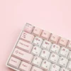 Pink Dress and Blue Hat Maltese Dog Keycap options side by side