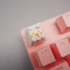 Pink rabbit artisan keycap in OEM profile mounted on an MX-style switch as an ESC key
