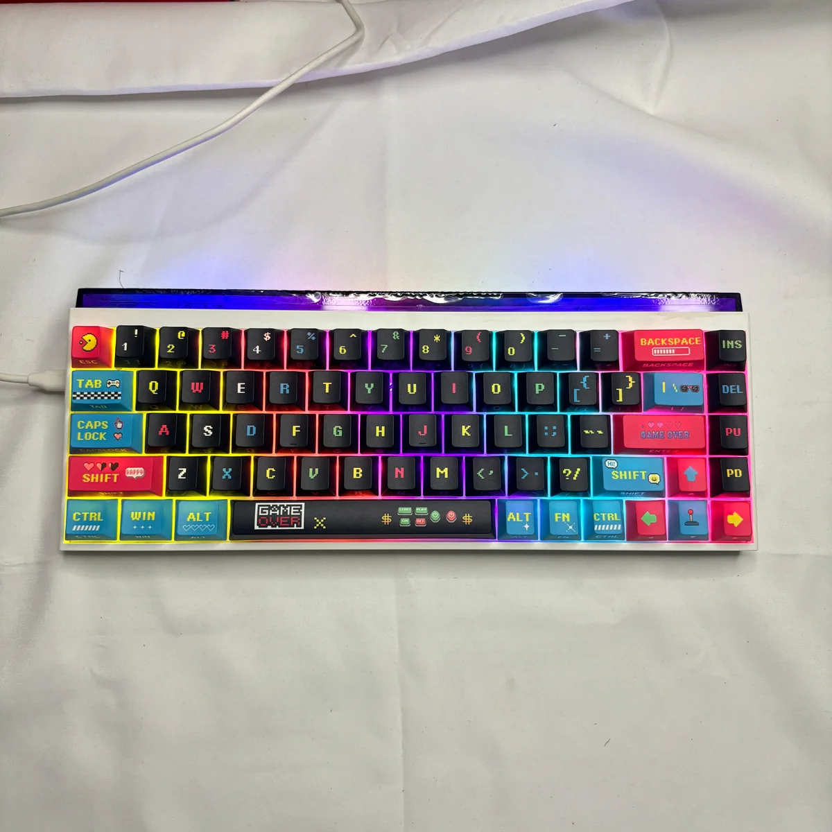 Macro shot of a single keycap with detailed pixel art design and legend clarity.