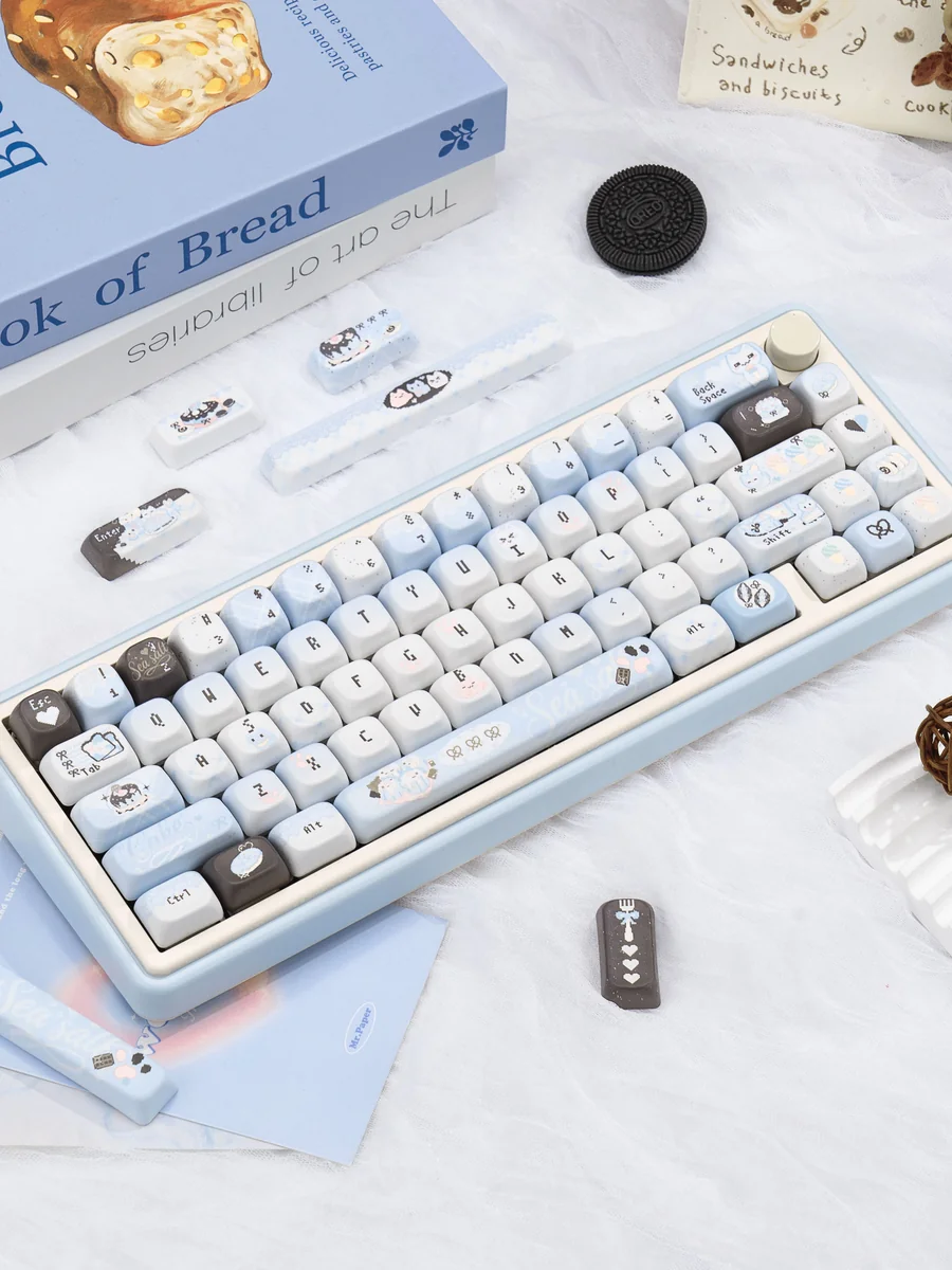 Keyboard with Pixel Cat keycaps in a clean setup