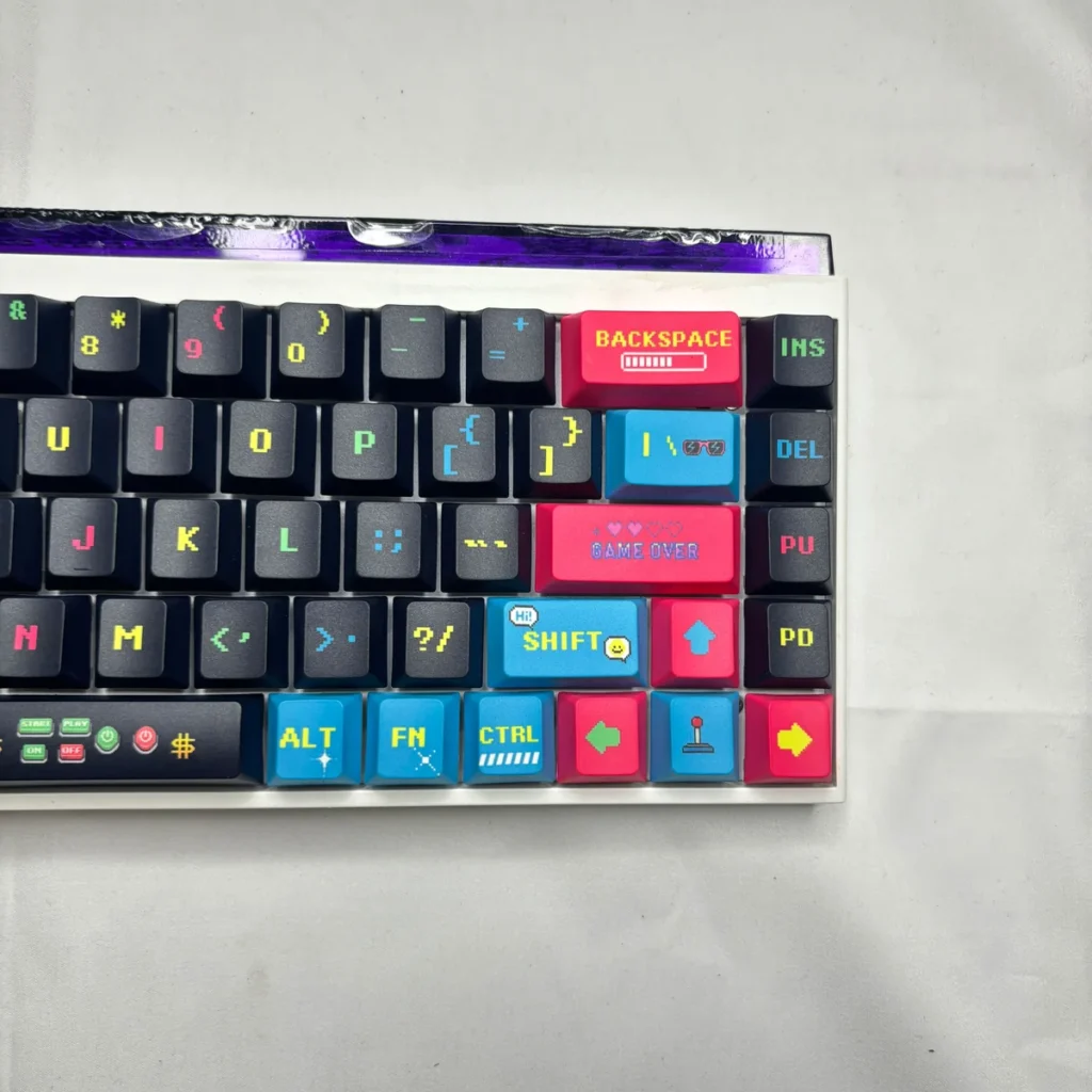 Pixel Video Games Keycap Set installed on a 65% mechanical keyboard, displaying full layout.