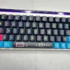 Close-up of keycaps showing dynamic side-lit translucent legends glowing with RGB backlight.