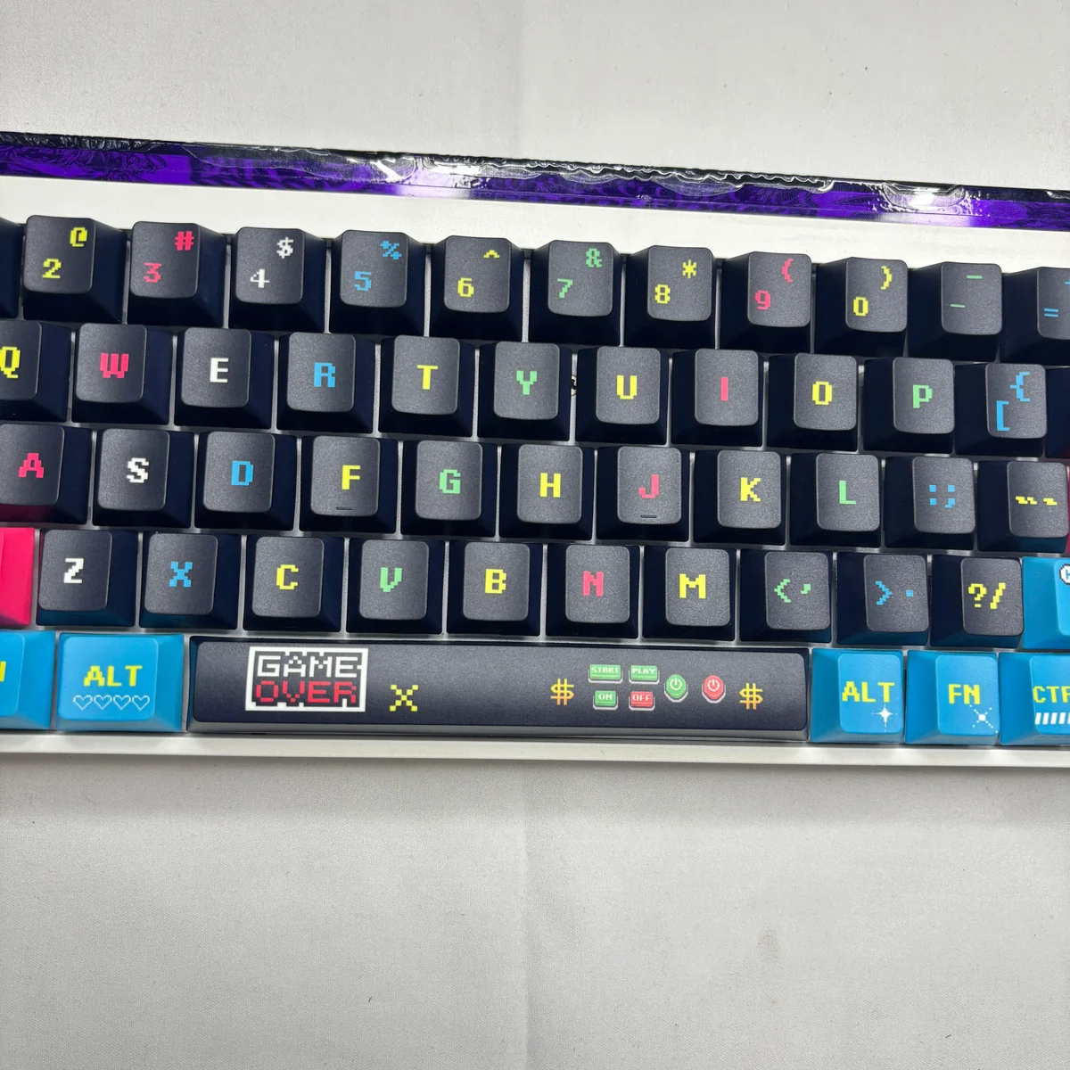 Close-up of keycaps showing dynamic side-lit translucent legends glowing with RGB backlight.