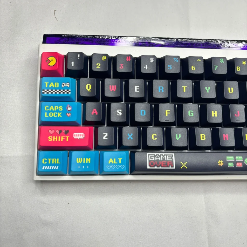 Angled view of the Pixel Video Games Keycap Set, highlighting the Cherry profile and PBT texture.