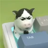 Niu Niu Cow Keycap from side, displaying resin texture