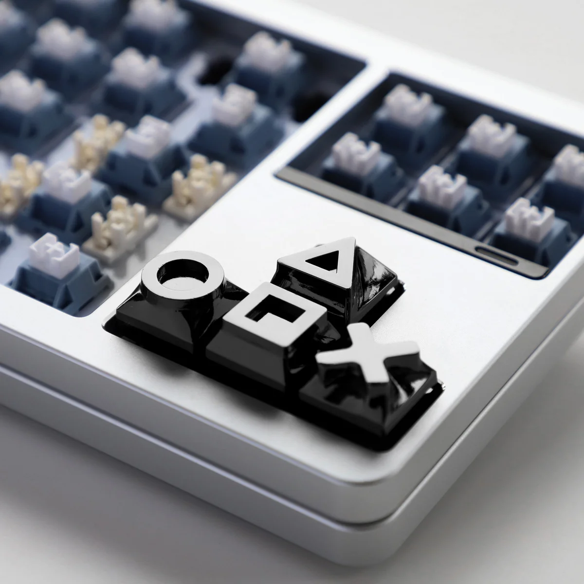 Gaming console keycap set installed on a dark mechanical keyboard, highlighting the retro design.