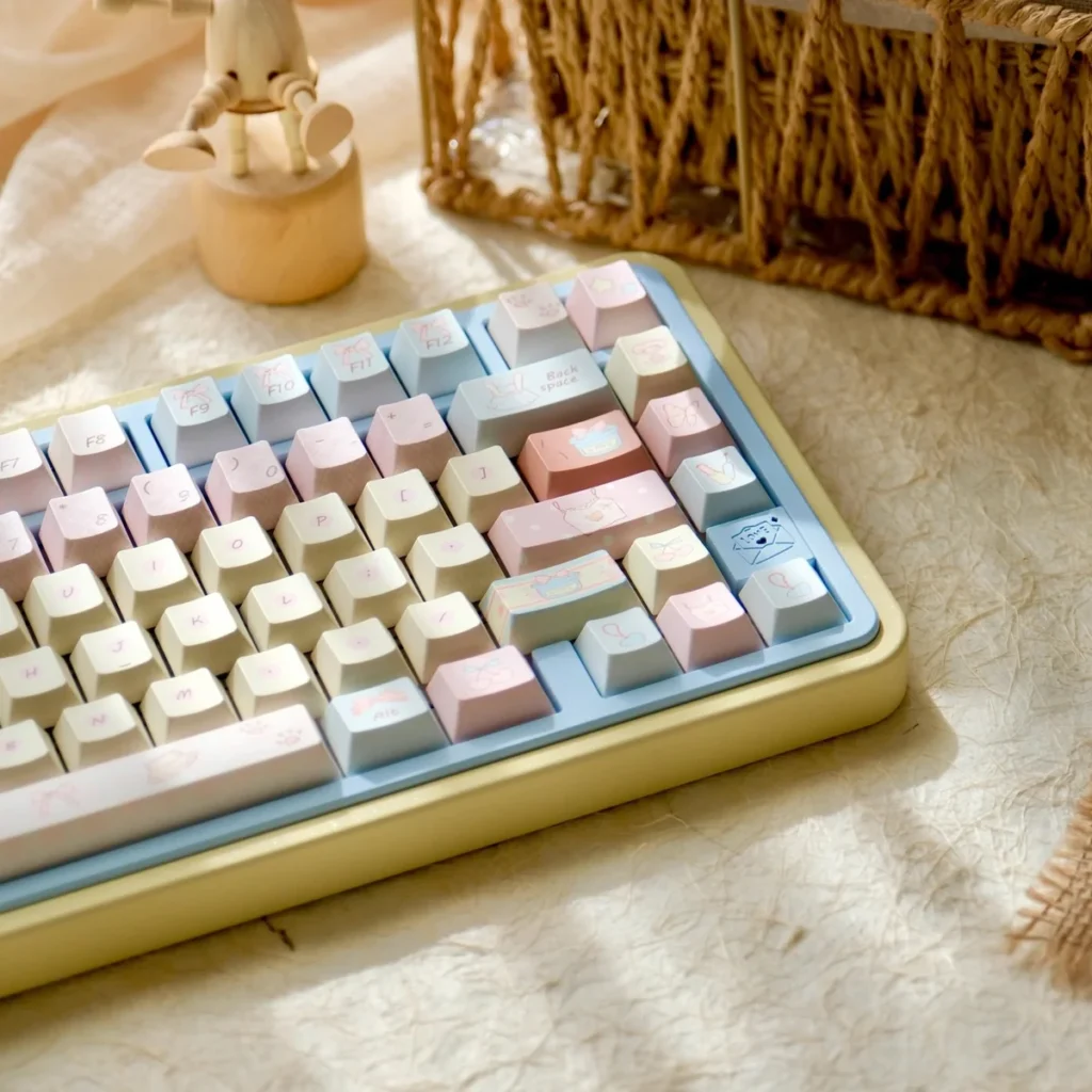 Close-up of pastel PBT dye-sub keycaps, highlighting intricate romantic legends.
