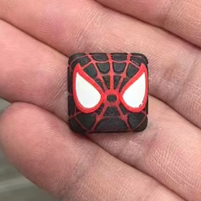 Handcrafted Spiderman artisan keycap made from vibrant resin, showcasing the iconic Marvel hero on a mechanical keyboard.