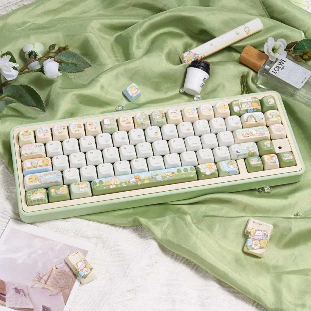 Full layout of Sumikko Gurashi PBT keycap set showcasing all 143 keys with pastel characters