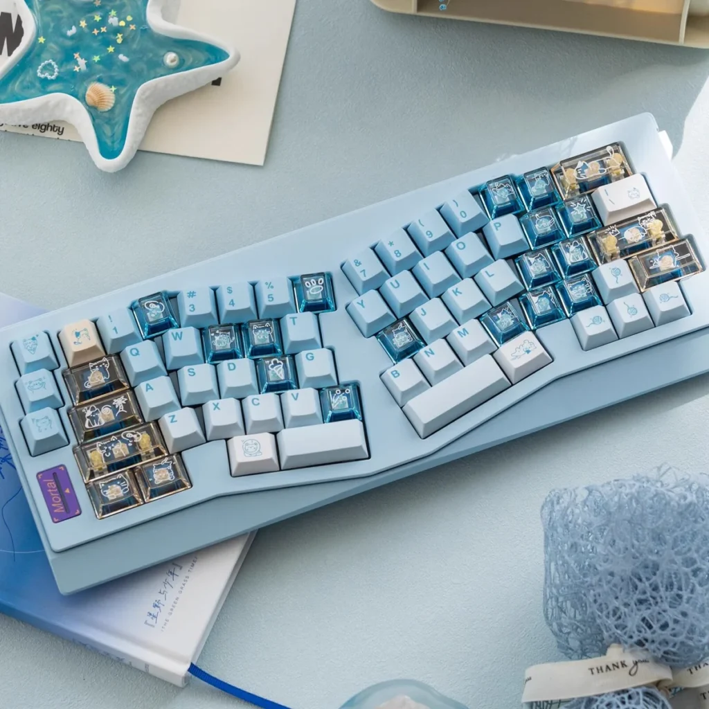 Summer Kitty PBT Dye-Sub Keycap Set on a white mechanical keyboard, showcasing vibrant cat designs and a full layout