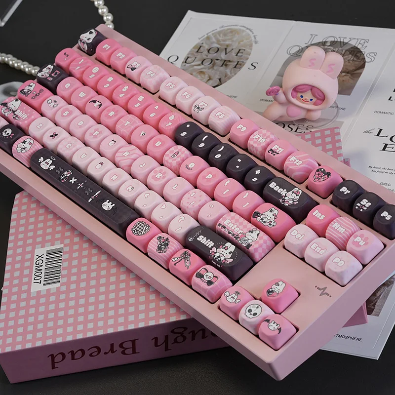Close-up of black and pink bunny keycaps